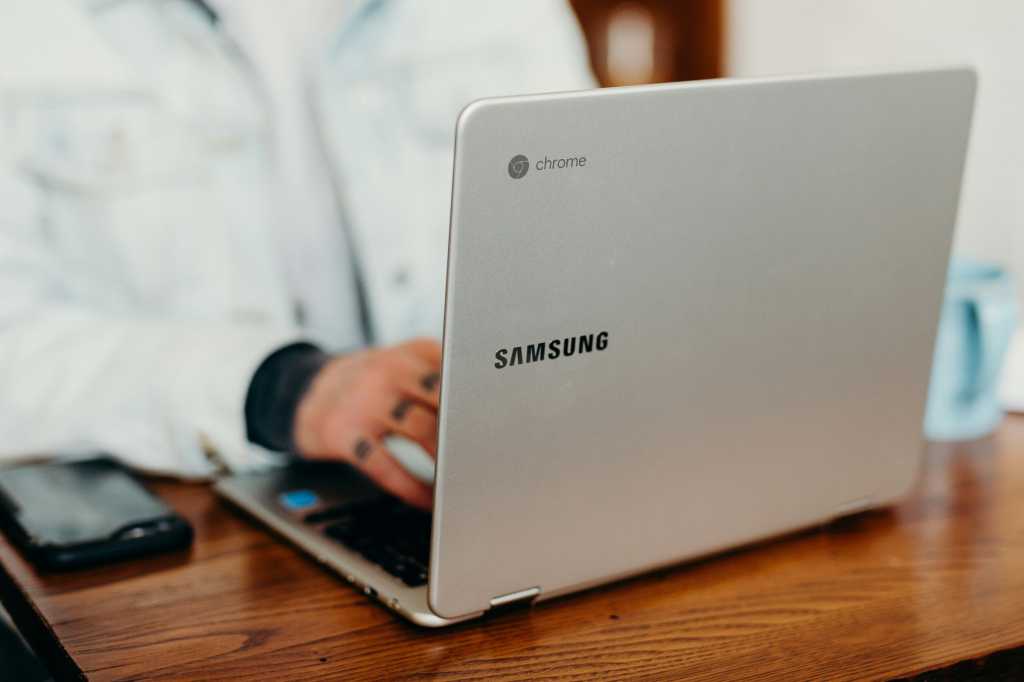Samsung Chromebook laptop being used on wooden desk