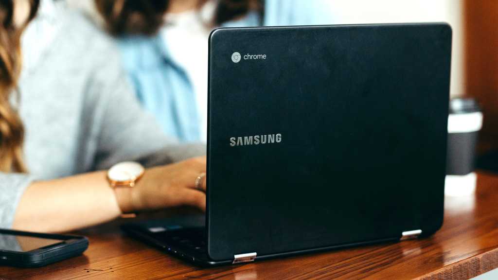 Samsung Chromebook open lid with women working on it