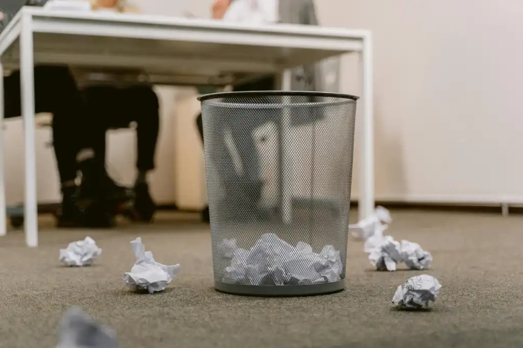 Paper in a wastebasket (and outside on the ground too)