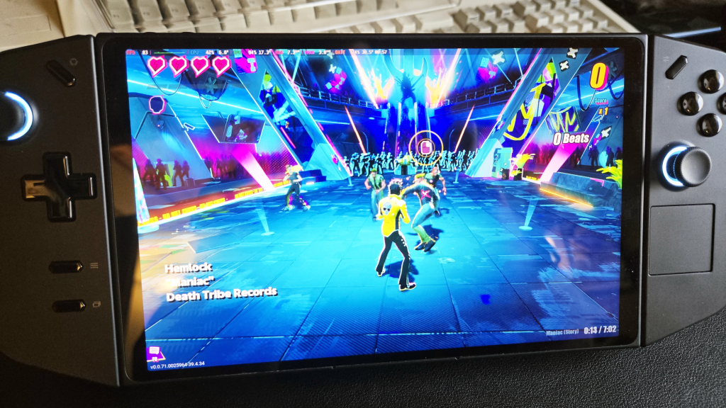 Lenovo Legion Go running Dead as Disco, with old keyboard in the background