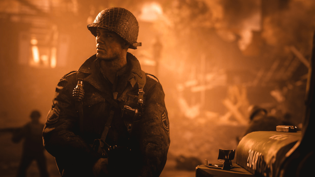 Call of Duty: WWII screenshot: an American soldier in a helmet stands next to a Jeep on an orange background.
