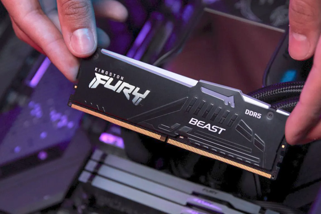 DDR5-RAM DIMM held over a motherboard