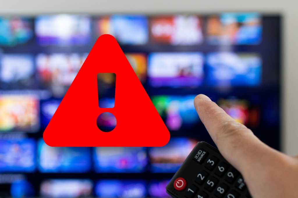 Man holding remote and pointing at smart TV with red warning icon