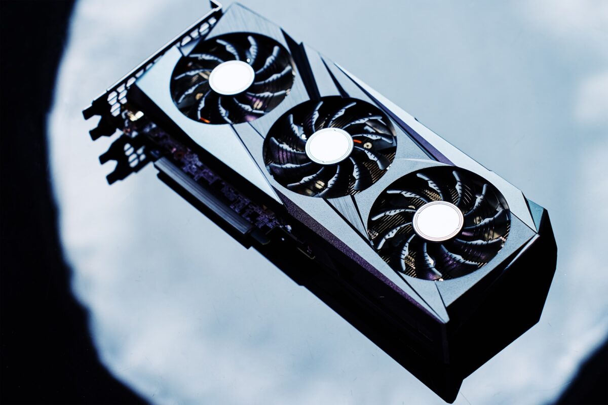 High-end graphics card with triple fan cooling on dark background