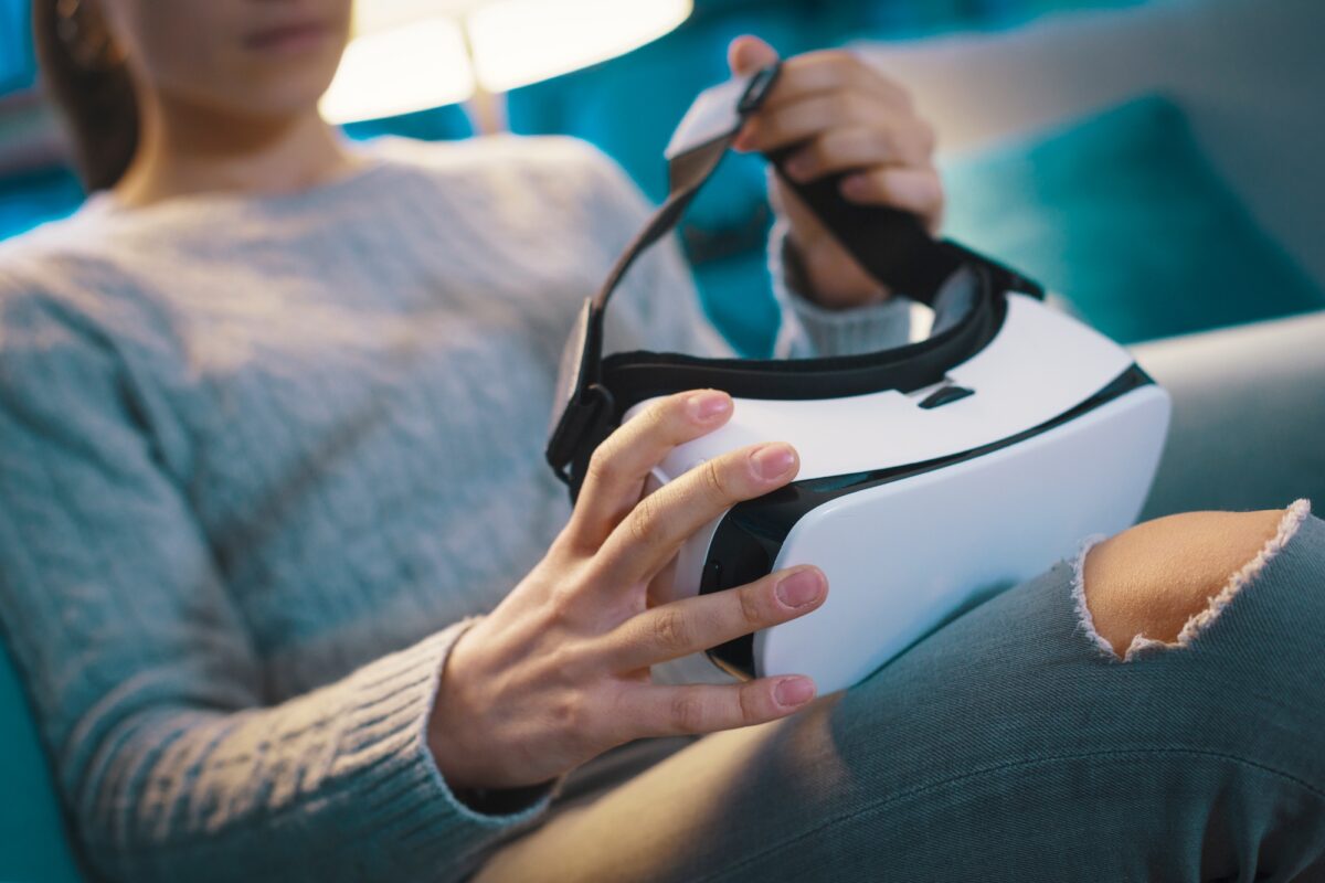 Woman holding a VR headset