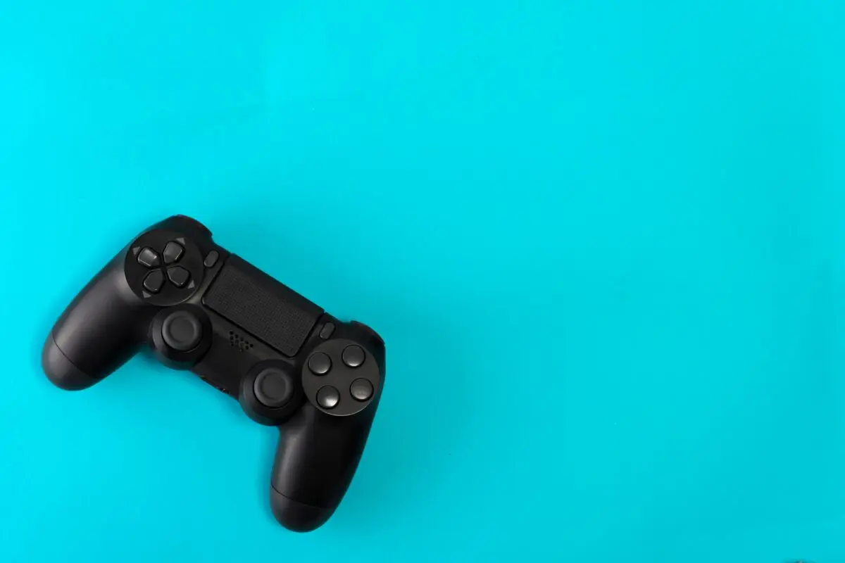 game controller on blue background studio shot