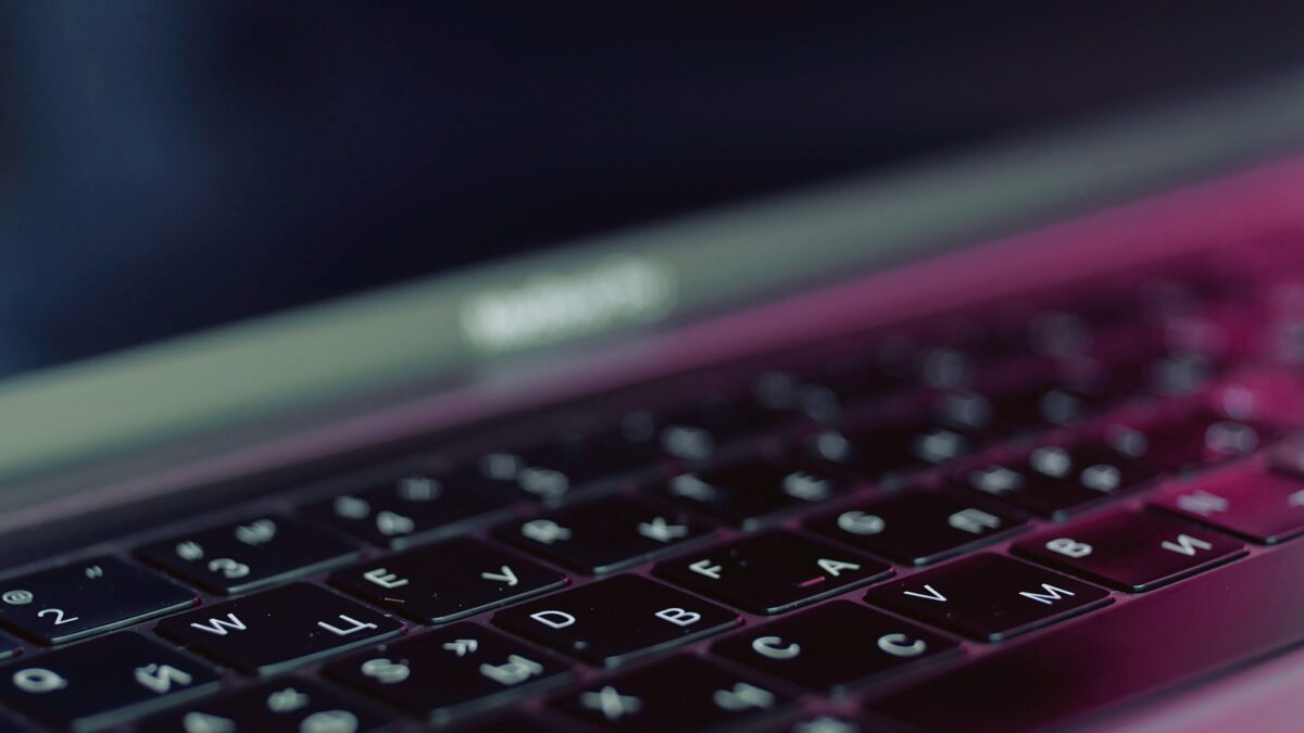 Silver laptop with black keybord details. Action. Close up of a new modern laptop, concept of